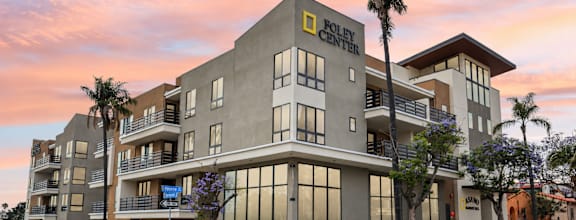 The Foley Center is a multi-story building with a modern design.