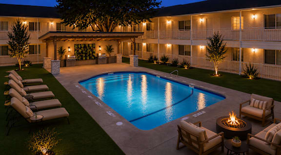 Courtyard pool area with lounge chairs at Creekline Apartments, Austin, 78757
