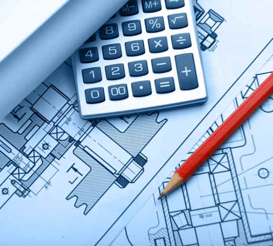 a calculator and pen sitting on top of a blueprint