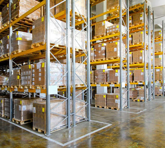 a large warehouse full of shelves of boxes
