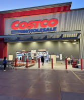 a costco store with a sign on the side of a building