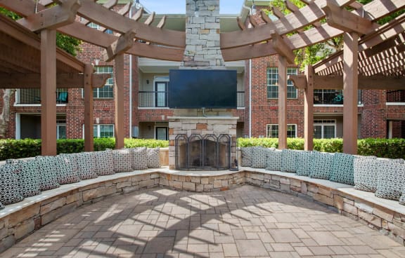a large living room with a pool table and couches