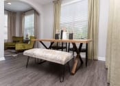 Thumbnail 12 of 40 - Living area with wood style flooring at Emblem Alpharetta, Alpharetta, GA