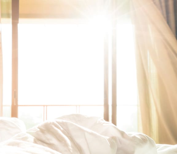 Bed with White Sheets at Chapel Springs Apartments, Perry Hall, Maryland