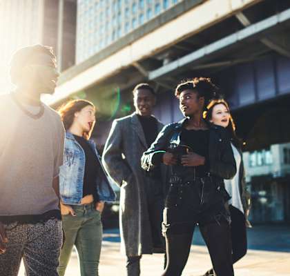 a group of people standing in front of a building