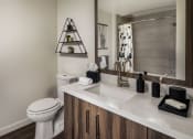 Thumbnail 24 of 27 - bath with white counter and sink and a toilet