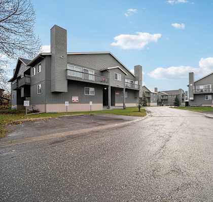 A road leads to a large building complex.