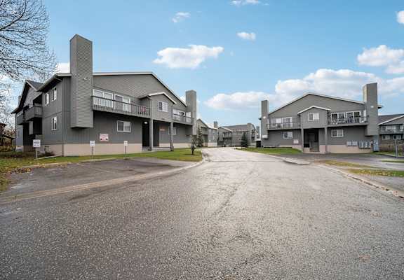 A road leads to a large building complex.