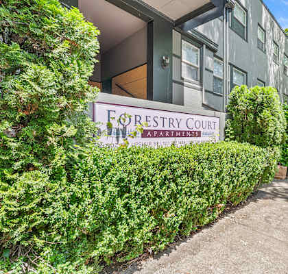 A building with a sign that says Forestry Court.