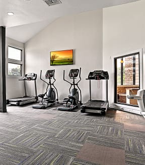 spacious gym with cardio equipment at the oxford condos tx