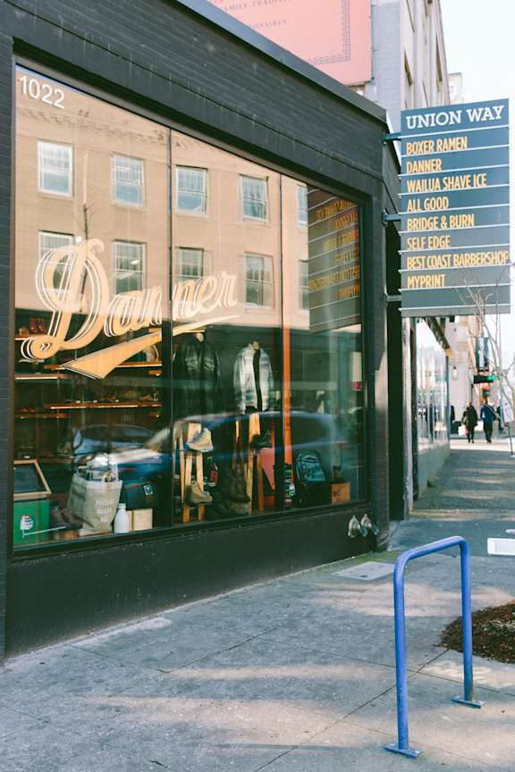 a window display of a clothing store on a city street