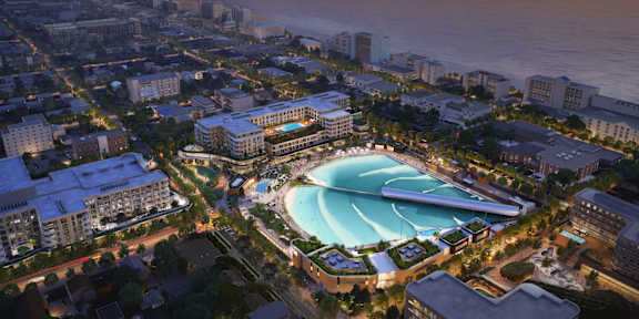 Aerial view of a city and a large pool at dusk at Atlantic Park Living, Virginia, 23451