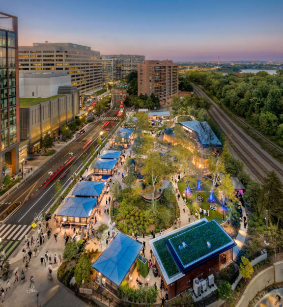 an aerial view of a city park with buildings and trees at The Bartlett in Arlington, VA 22202