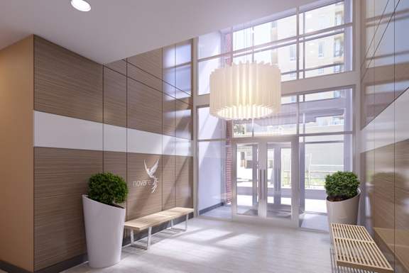 a large lobby with large windows and a large chandelier