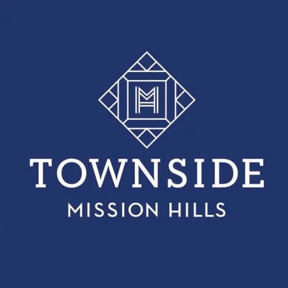 a logo for townside mission hills on a blue background