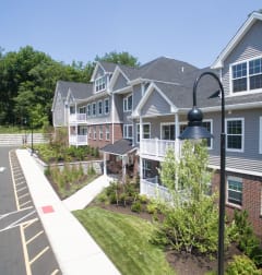 a row of houses on a street at Zephyr Ridge Apartment Homes, Cedar Grove, NJ