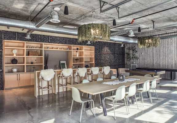 A conference room with a long table and chairs.