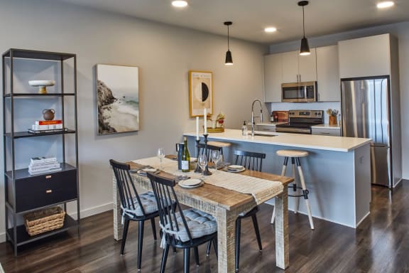 A modern kitchen with a dining table set for two at Sono Central in Norwalk, CT, 06854