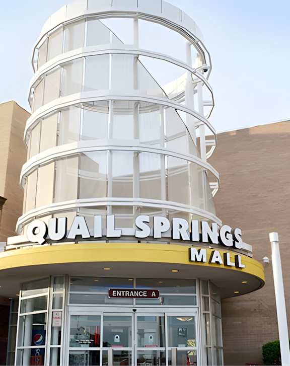 A street view of Legal Cinemas 16 with a clear sky above.