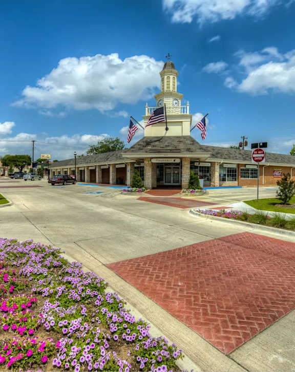 A street view of Legal Cinemas 16 with a clear sky above.