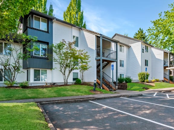 Elmonica Court apartments building exteriors, carports, and parking lot