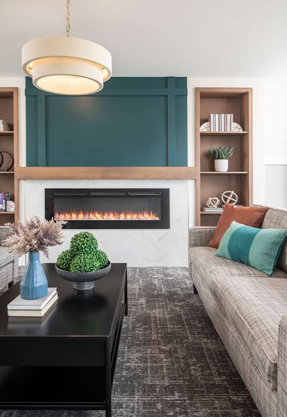a living room with a fireplace and a couch