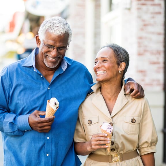 an older man and woman eating ice cream together at Avellan Springs Apartments, Morrisville, NC