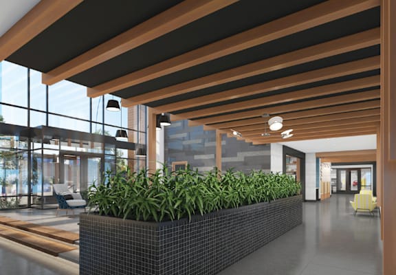 A long hallway with a planter box on the floor.
