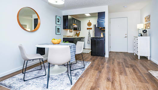 a dining room and kitchen with a table and chairs at Weaver Farm, Florence, 41042