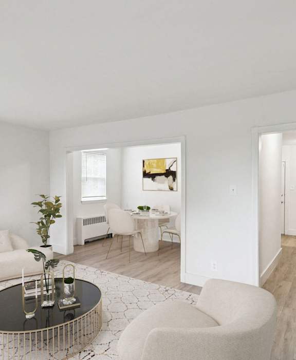 a living room with a white couch and a coffee table