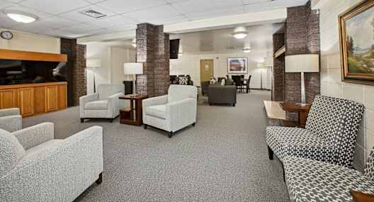 a lobby filled with furniture and a television