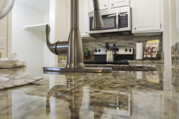 This is a photo of the kitchen of a 1245 square foot 2 bedroom apartment at Cambridge Court Apartments in Dallas, TX.