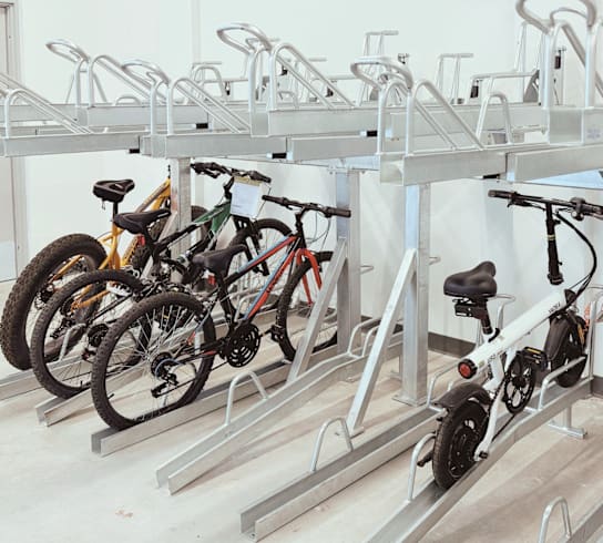 A bike rack with several bikes parked on it.