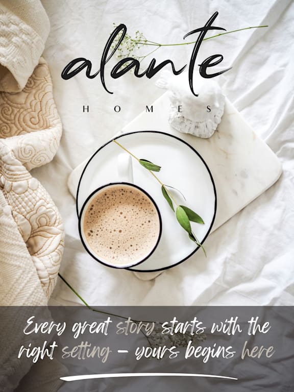 A cup of coffee on a bed with a blanket and a pillow with the text at Alante Homes at Spring Run, Idaho