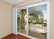 Thumbnail 32 of 41 - Mar Vista Apartments for Rent - Vista - Jones & Jones - Living Room With Sliding Glass Door Toward Patio