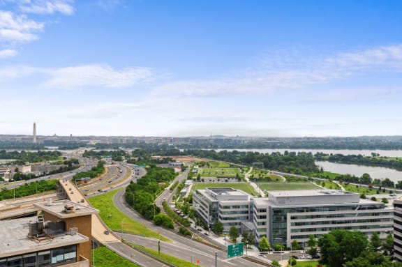 an aerial view of a city with a river in the background