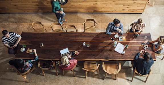 people sitting around a table in a restaurant at Sono Central in Norwalk, CT, 06854
