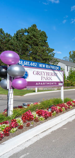 apartment sign with balloons