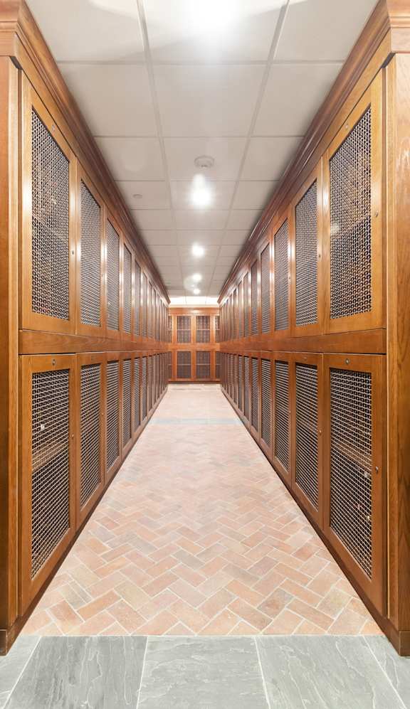a large room with wooden lockers and a tiled floor at HIGHGROVE, Stamford, Connecticut