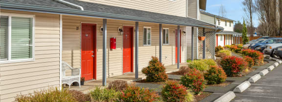a row of houses with red doors  at Quilceda Gardens, Marysville, WA 98270