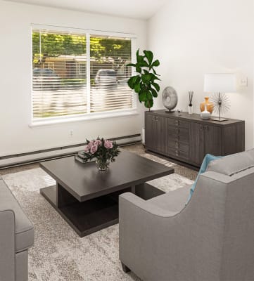 a living room with two couches and a coffee table at Park View Apartments, Wenatchee Washington