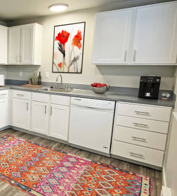 a kitchen with white appliances and white cabinets at Quilceda Gardens, Marysville, WA 98270