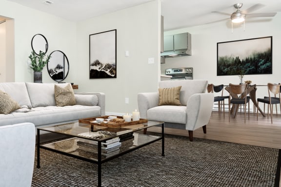 a living room with white couches and chairs and a glass coffee table  at University Glen, University Place, 98466