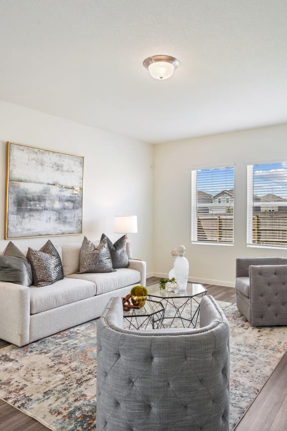 a bedroom with white walls and carpet