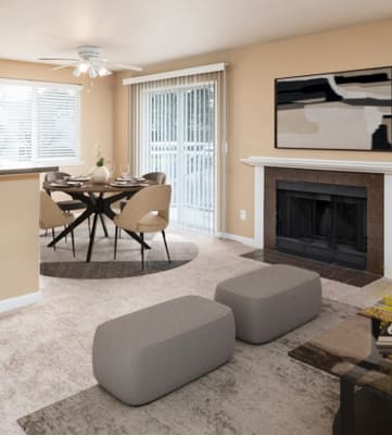 a living room with a fireplace and a table and chairs at Springfield, Renton, 98055