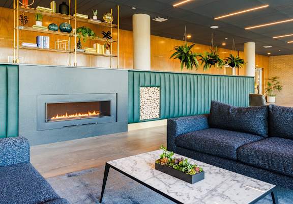 a living room with a couch and a fireplace