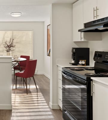 a kitchen and dining area in a 555 waverly unit at Pointe East, Washington