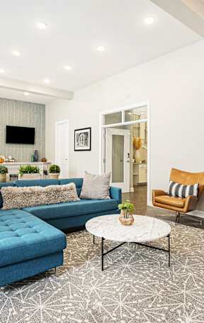 a living room and dining room with a couch and a table