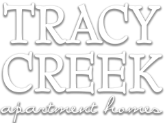 Property entrance sign with branding at Tracy Creek Homes Apartments, Perrysburg, OH