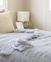 a bedroom with a bed and pillows